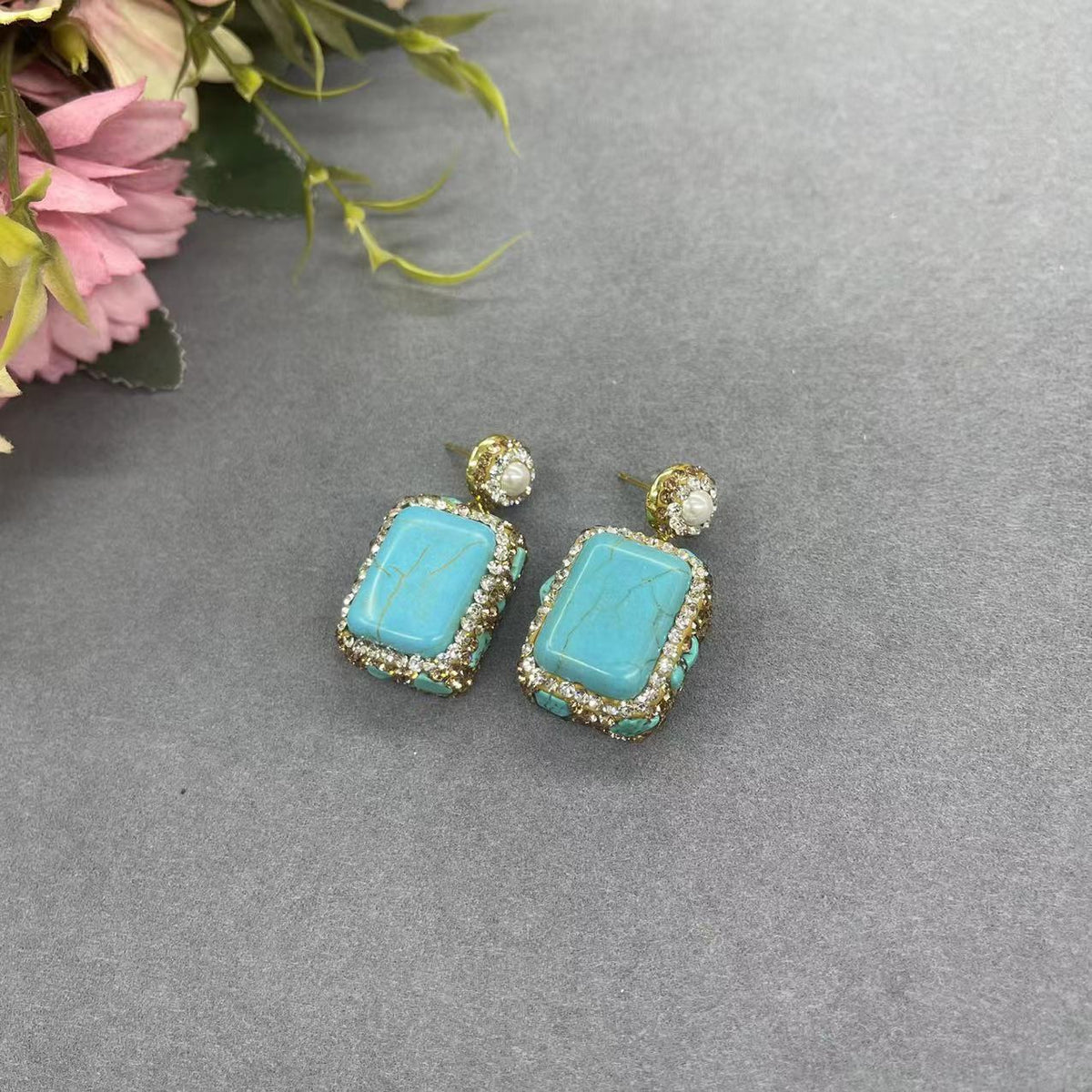Turquoise-tone earrings with rhinestone frame