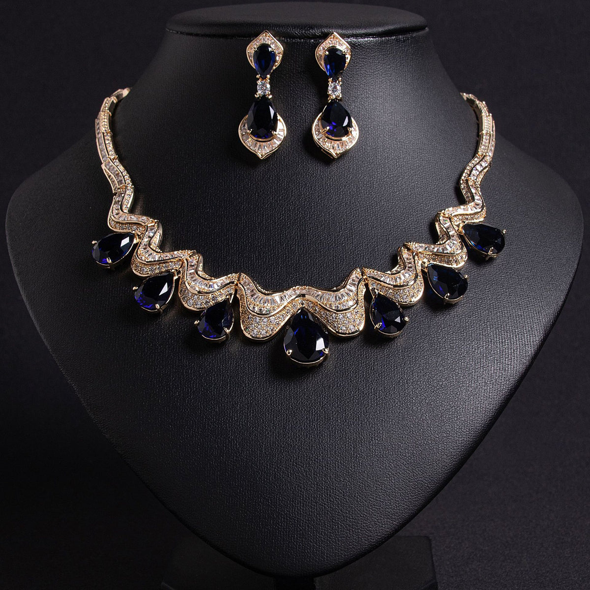 Yasmin wave teardrop bridal set, gold with sapphire-blue stones