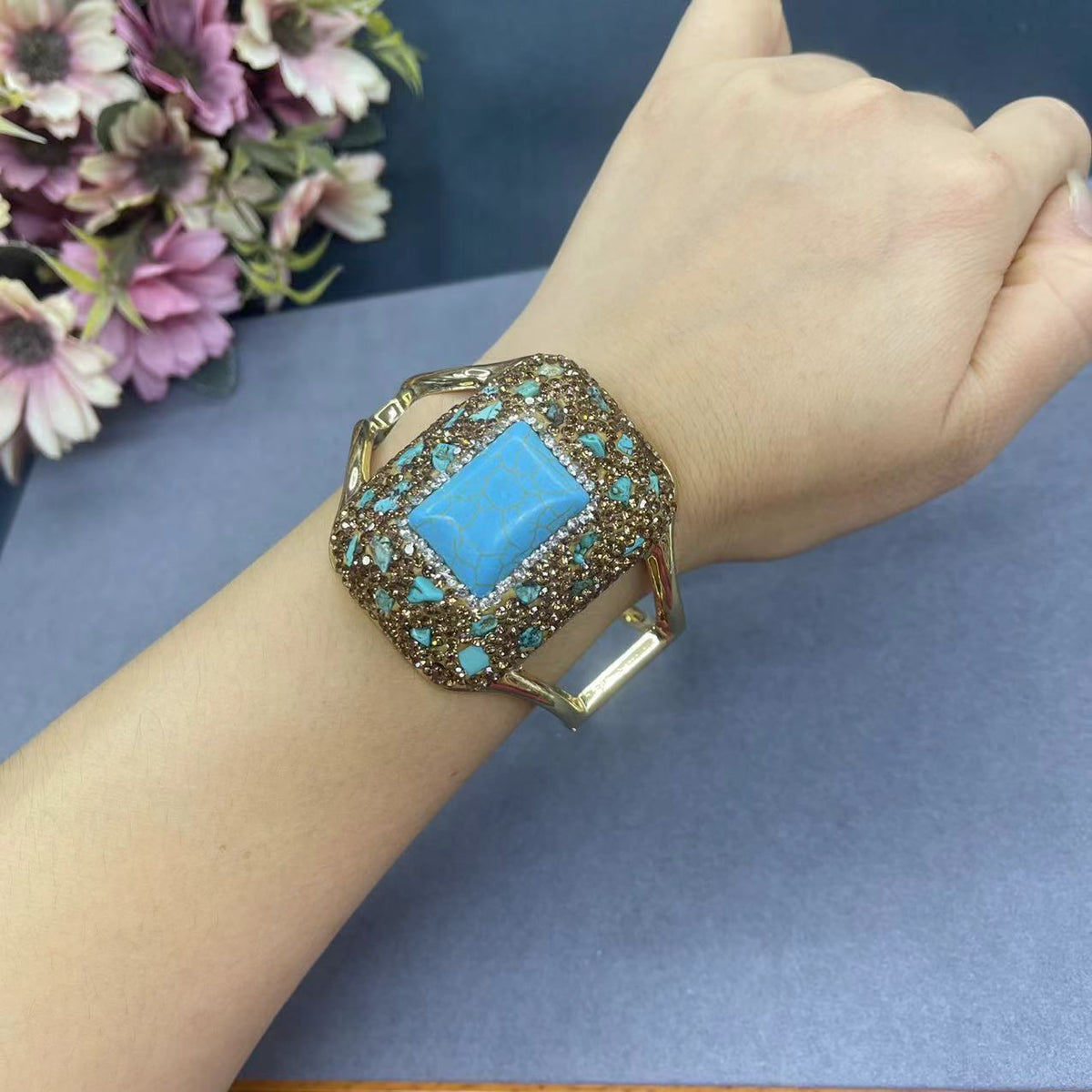 Turquoise cuff bangle worn on the wrist