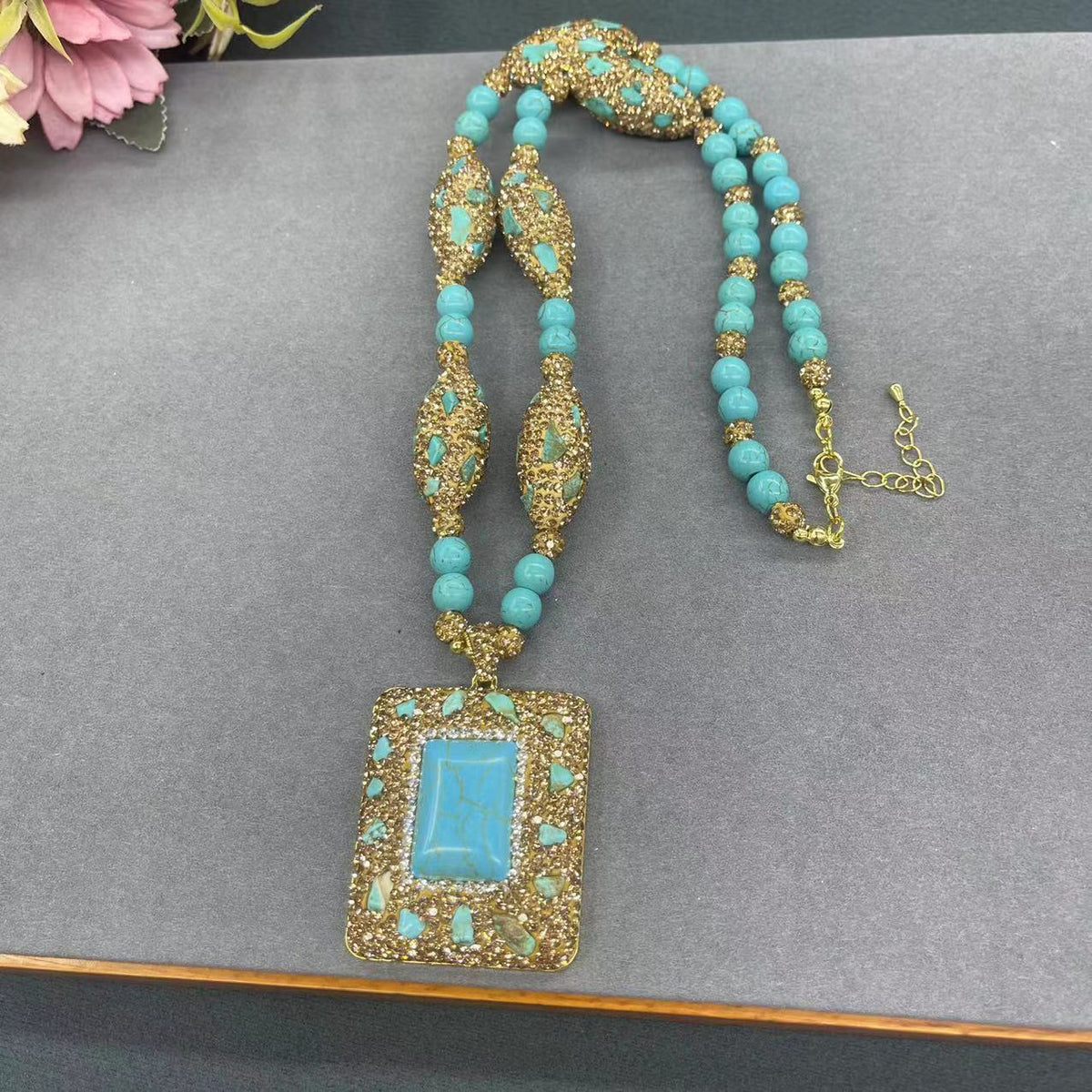 Turquoise-tone beaded necklace with rectangular pendant