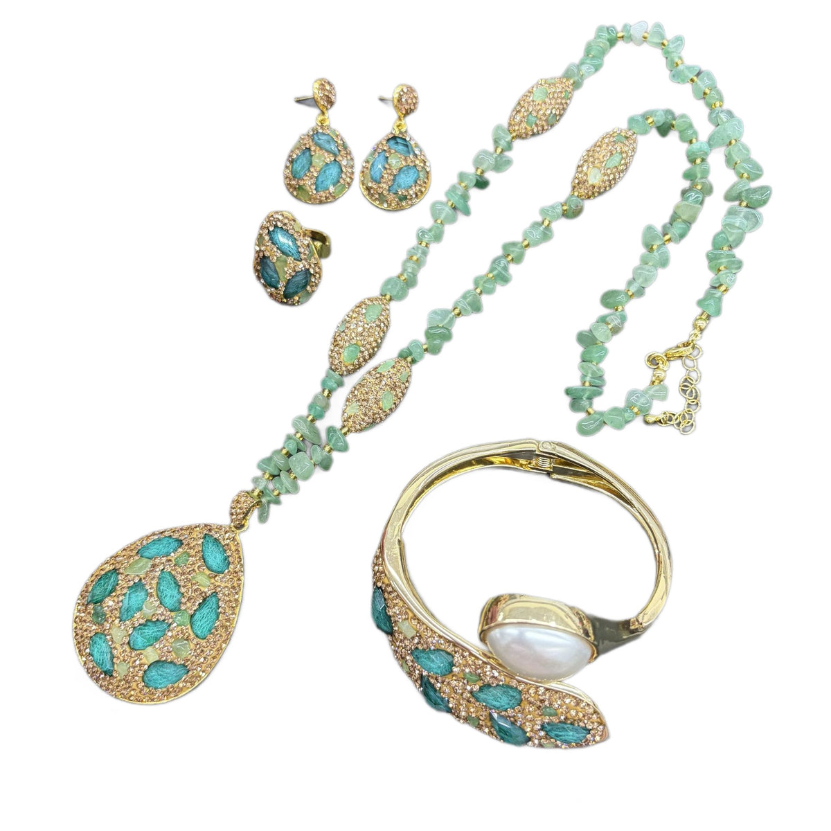 Green teardrop jewelry set on white background