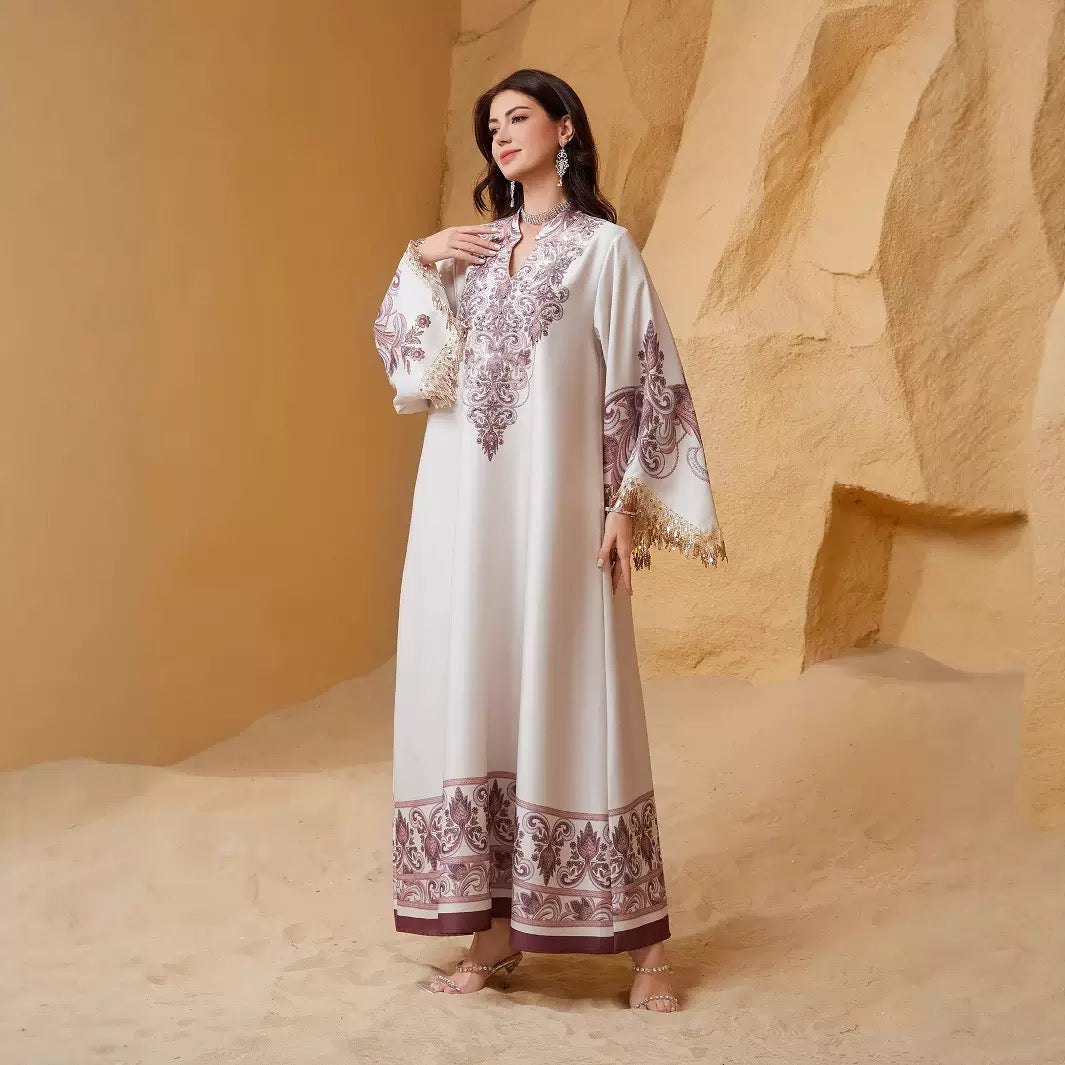 White and mauve abaya with decorative hem border, side view