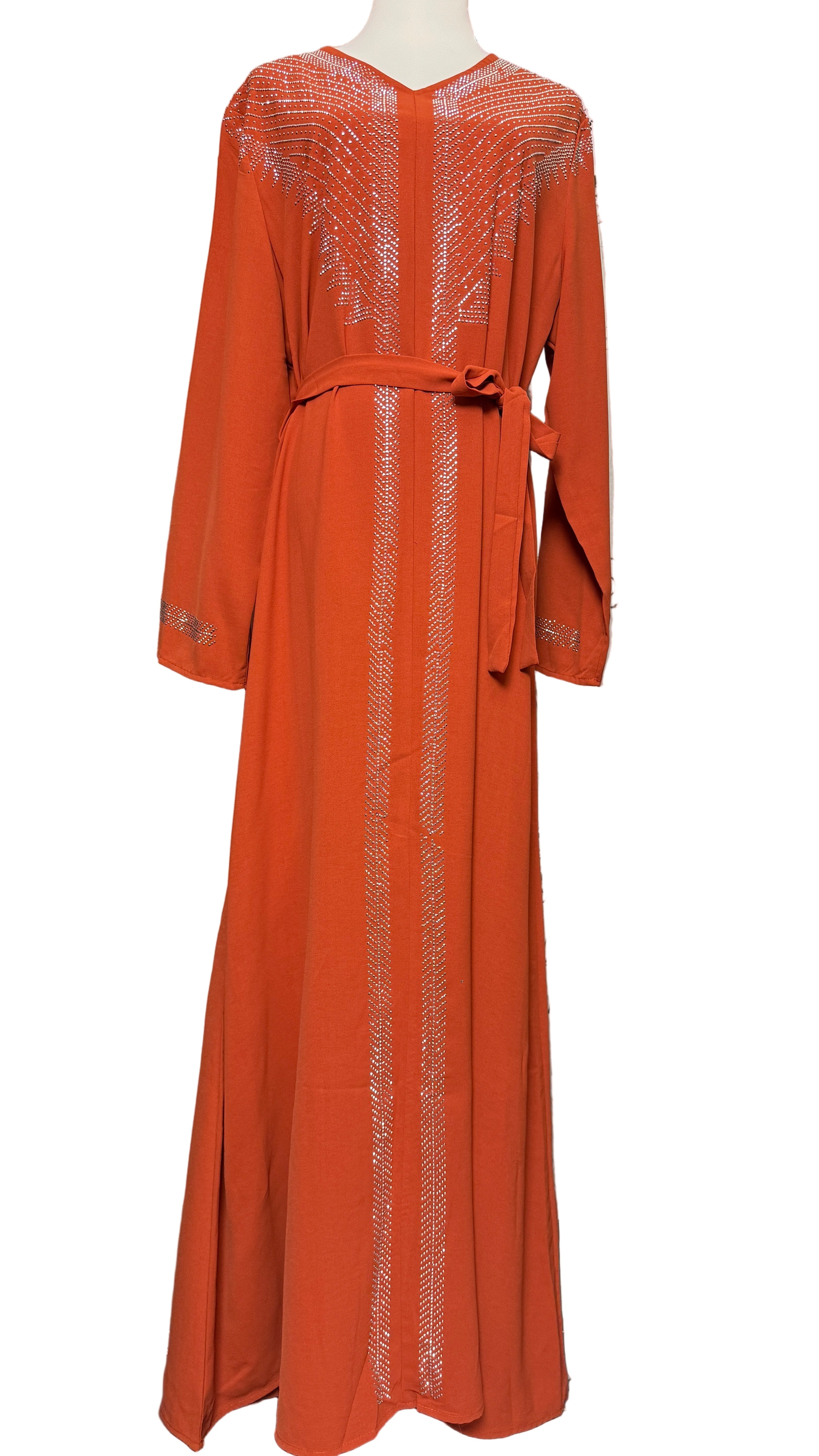 Orange long-sleeve dress with intricate detailing on a white background