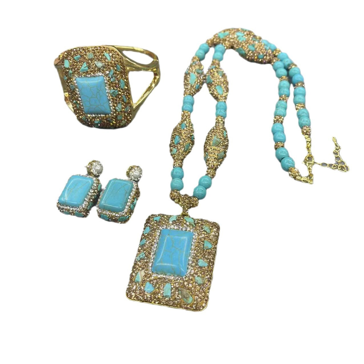 Turquoise jewelry set laid out on a table