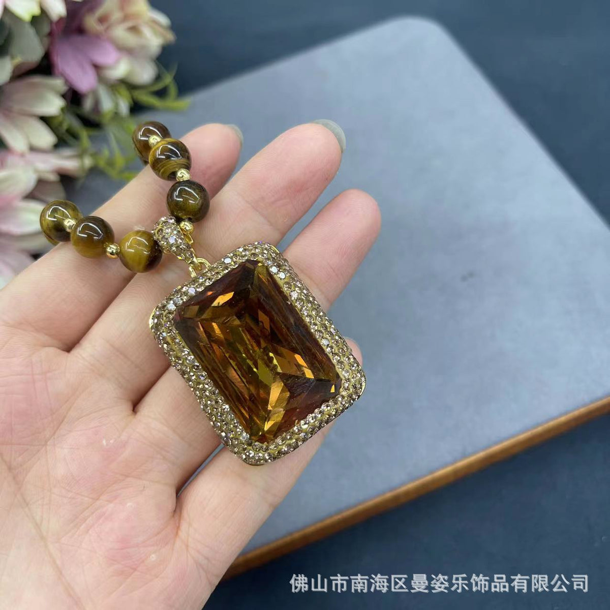 Amber-color stone pendant close-up